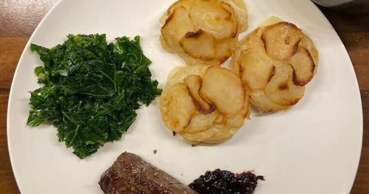 Juniper-flavoured Venison Steaks with Berry Compôte and Kale